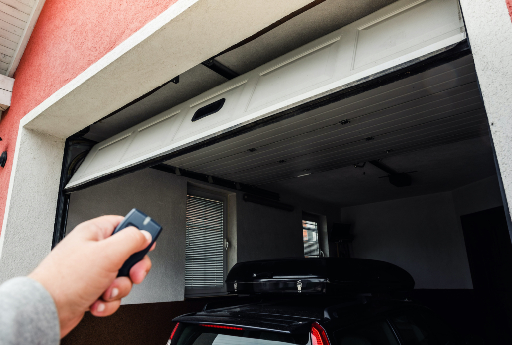 Garage door PVC. Hand use remote controller for closing and opening garage door. Garage door PVC. Hand use remote controller for closing and opening garage door.